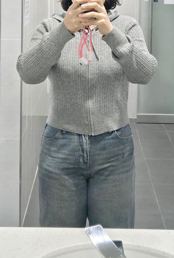 After tummy tuck of Dasitaeeonayana in Korea—jeans and sweater outfit showing slim silhouette.