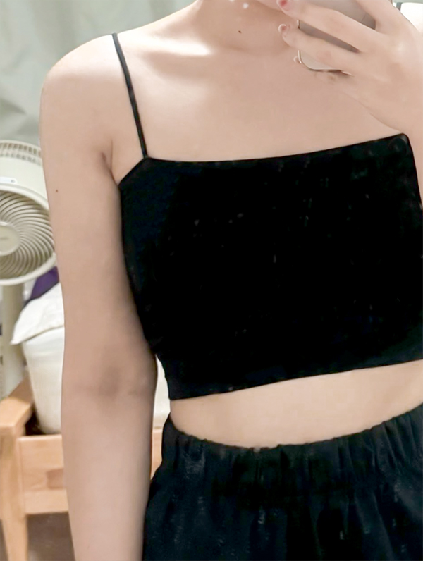 After arm liposuction of Gangidongi in Korea—black spaghetti strap top, arms appear slimmer with a visible shoulder line.