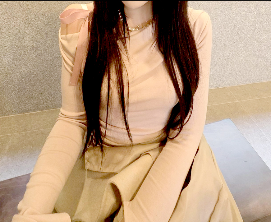 After photo of Nyangiq4BuF in Korea—wearing peach fitted top, showing slim arm line.