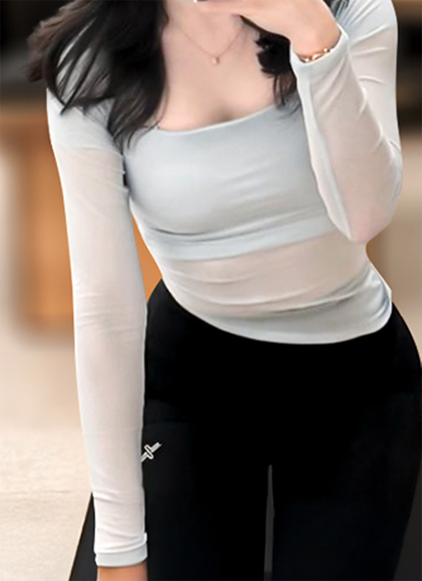 After arm liposuction of Santamarianobellam in Korea—light gray fitted top, arms appear toned and lean.