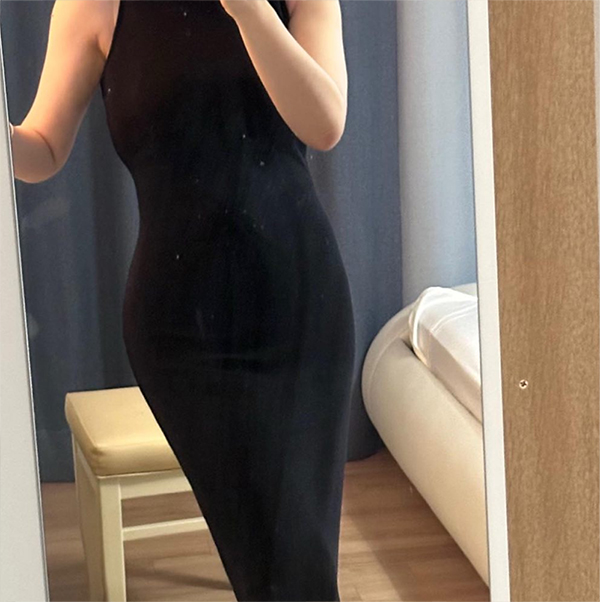 After abdominal liposuction and buttocks fat transfer of YeouGqqxu in Korea—front view in black dress, slim waist and defined silhouette.