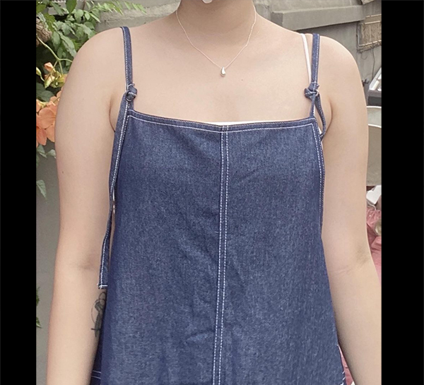 Before arm liposuction of bbella2 in Korea (Apgujeong)—sleeveless denim dress with arms fully visible.