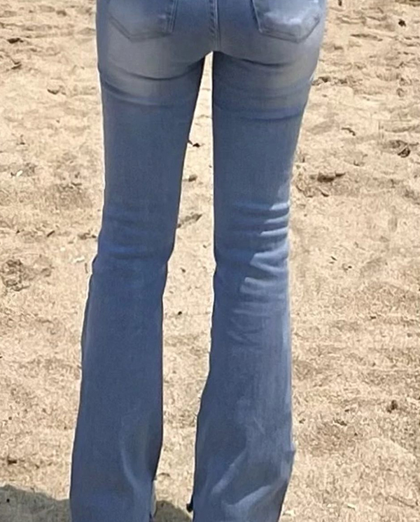 Slim thighs in fitted jeans reveal clear surgical results after fat removal in Korea.