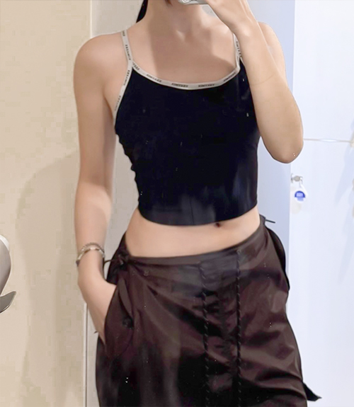 After photo of pingpong89 with flat stomach and visible abs line following abdominal liposuction at Lesarts Plastic Surgery.